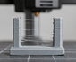 3D print showing stringing between two towers
